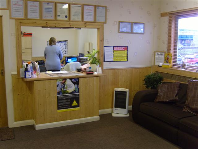reception desk with waiting room sofa